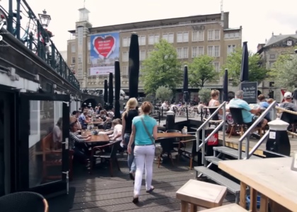 many people at the tables in the restaurant having breakfast