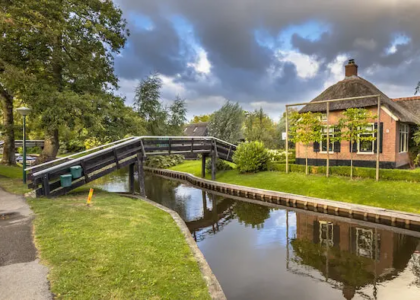 Giethoorn village with a house and a river