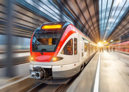 a high-speed train with motion blur, taken at a station