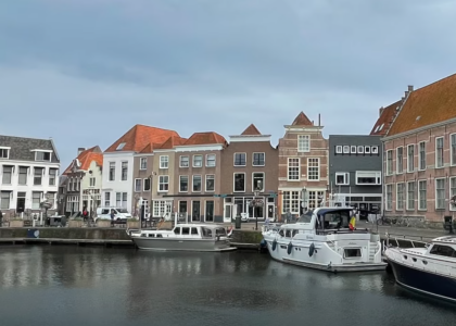 Scenic view of a lake with prominent buildings and boats